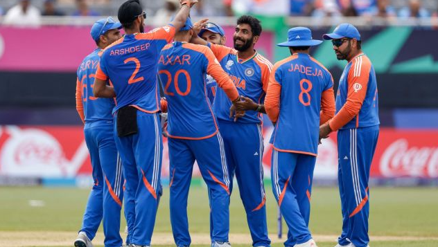 India's Jasprit Bumrah, third from right, is congratulated by teammates after taking the wicket of Ireland's Harry Tector during an ICC Men's T20 World Cup cricket match at the Nassau County International Cricket Stadium in Westbury, New York, Wednesday, June 5, 2024.